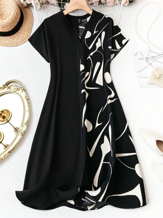 A black half print dress